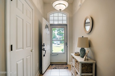 Welcome to this charming brick-front home tucked inside the on Brunswick Plantation and Golf Resorts in North Carolina - for sale on GolfHomes.com, golf home, golf lot