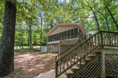 Cute open floorplan cottage on Lake Catherine in Diamondhead on Diamondhead Golf and Country Club in Arkansas - for sale on GolfHomes.com, golf home, golf lot