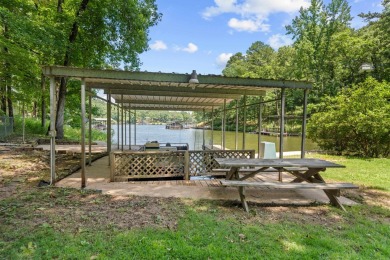 Cute open floorplan cottage on Lake Catherine in Diamondhead on Diamondhead Golf and Country Club in Arkansas - for sale on GolfHomes.com, golf home, golf lot