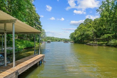 Cute open floorplan cottage on Lake Catherine in Diamondhead on Diamondhead Golf and Country Club in Arkansas - for sale on GolfHomes.com, golf home, golf lot