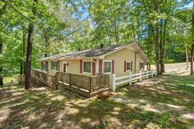 Cute open floorplan cottage on Lake Catherine in Diamondhead on Diamondhead Golf and Country Club in Arkansas - for sale on GolfHomes.com, golf home, golf lot