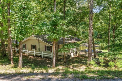 Cute open floorplan cottage on Lake Catherine in Diamondhead on Diamondhead Golf and Country Club in Arkansas - for sale on GolfHomes.com, golf home, golf lot