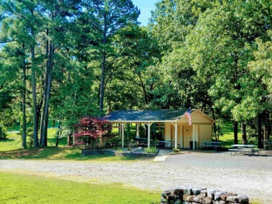 Cute open floorplan cottage on Lake Catherine in Diamondhead on Diamondhead Golf and Country Club in Arkansas - for sale on GolfHomes.com, golf home, golf lot