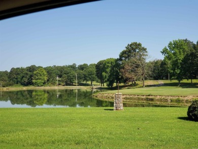 Cute open floorplan cottage on Lake Catherine in Diamondhead on Diamondhead Golf and Country Club in Arkansas - for sale on GolfHomes.com, golf home, golf lot