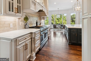 Privately tucked behind a long, tree-lined driveway and greeted on Chateau Elan Golf Club  in Georgia - for sale on GolfHomes.com, golf home, golf lot