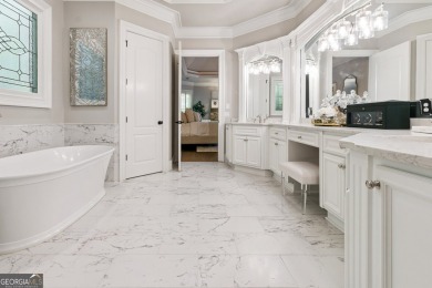 Privately tucked behind a long, tree-lined driveway and greeted on Chateau Elan Golf Club  in Georgia - for sale on GolfHomes.com, golf home, golf lot