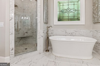 Privately tucked behind a long, tree-lined driveway and greeted on Chateau Elan Golf Club  in Georgia - for sale on GolfHomes.com, golf home, golf lot