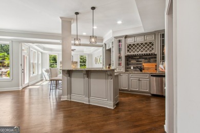 Privately tucked behind a long, tree-lined driveway and greeted on Chateau Elan Golf Club  in Georgia - for sale on GolfHomes.com, golf home, golf lot