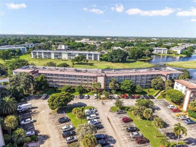 Renovated 1st Floor Condo with Water & Golf Course Views in on Wynmoor Golf Course in Florida - for sale on GolfHomes.com, golf home, golf lot