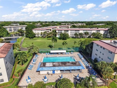 Renovated 1st Floor Condo with Water & Golf Course Views in on Wynmoor Golf Course in Florida - for sale on GolfHomes.com, golf home, golf lot