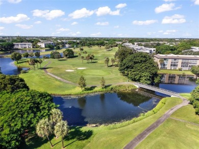 Renovated 1st Floor Condo with Water & Golf Course Views in on Wynmoor Golf Course in Florida - for sale on GolfHomes.com, golf home, golf lot