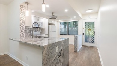 Renovated 1st Floor Condo with Water & Golf Course Views in on Wynmoor Golf Course in Florida - for sale on GolfHomes.com, golf home, golf lot