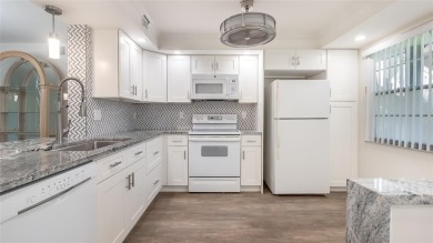 Renovated 1st Floor Condo with Water & Golf Course Views in on Wynmoor Golf Course in Florida - for sale on GolfHomes.com, golf home, golf lot