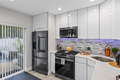 This tastefully remodeled townhome was designed with style and on Birchwood at Spring Lake in New York - for sale on GolfHomes.com, golf home, golf lot