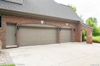 This custom property is tucked away on a quiet cul-de-sac is in on Oakhurst Golf and Country Club in Michigan - for sale on GolfHomes.com, golf home, golf lot