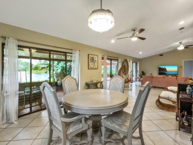 This stunning lakefront home in the highly desirable Elysium on Village Golf Club in Florida - for sale on GolfHomes.com, golf home, golf lot