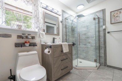 This beautifully renovated 3-bedroom, 3-bathroom home is the on Pocono Farms Country Club in Pennsylvania - for sale on GolfHomes.com, golf home, golf lot