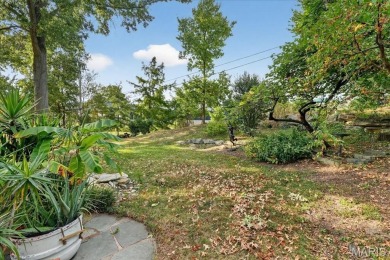 Welcome to your dream home! Nestled on a spacious, park-like lot on Greenbriar Hills Country Club in Missouri - for sale on GolfHomes.com, golf home, golf lot