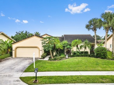 This stunning lakefront home in the highly desirable Elysium on Village Golf Club in Florida - for sale on GolfHomes.com, golf home, golf lot