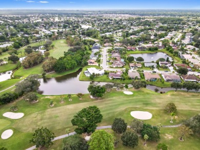 This stunning lakefront home in the highly desirable Elysium on Village Golf Club in Florida - for sale on GolfHomes.com, golf home, golf lot