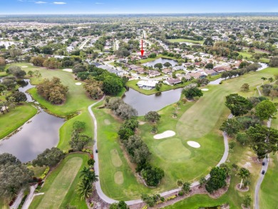 This stunning lakefront home in the highly desirable Elysium on Village Golf Club in Florida - for sale on GolfHomes.com, golf home, golf lot