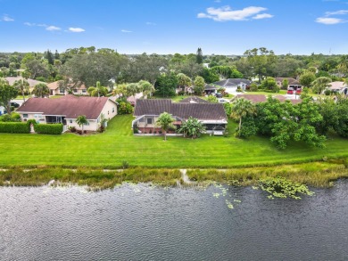 This stunning lakefront home in the highly desirable Elysium on Village Golf Club in Florida - for sale on GolfHomes.com, golf home, golf lot