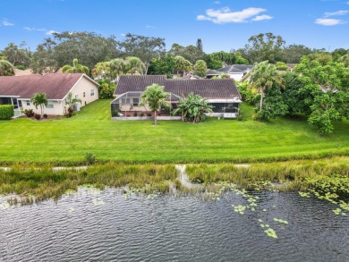 This stunning lakefront home in the highly desirable Elysium on Village Golf Club in Florida - for sale on GolfHomes.com, golf home, golf lot