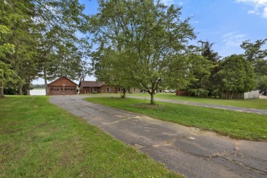 Rare opportunity on all-sports Goguac Lake! This 3-bedroom, 2 on Battle Creek Country Club in Michigan - for sale on GolfHomes.com, golf home, golf lot