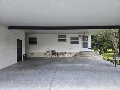 ZELLWOOD STATION 2 BEDROOM 2 BATH HOME located on a quiet on Zellwood Station Country Club in Florida - for sale on GolfHomes.com, golf home, golf lot