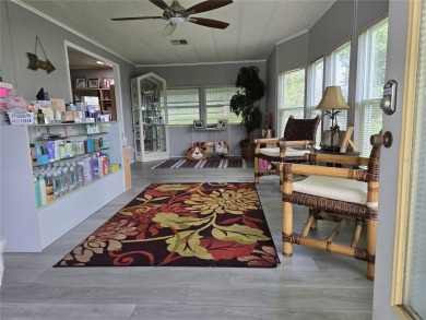 ZELLWOOD STATION 2 BEDROOM 2 BATH HOME located on a quiet on Zellwood Station Country Club in Florida - for sale on GolfHomes.com, golf home, golf lot