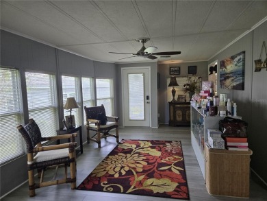 ZELLWOOD STATION 2 BEDROOM 2 BATH HOME located on a quiet on Zellwood Station Country Club in Florida - for sale on GolfHomes.com, golf home, golf lot