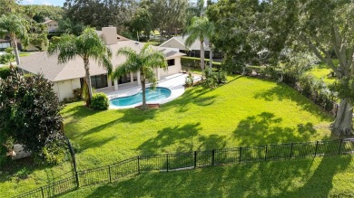 Impressive Carrollwood Village home in a beautiful a on Emerald Greens Golf Resort and Country Club in Florida - for sale on GolfHomes.com, golf home, golf lot