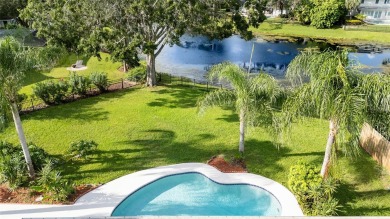 Impressive Carrollwood Village home in a beautiful a on Emerald Greens Golf Resort and Country Club in Florida - for sale on GolfHomes.com, golf home, golf lot