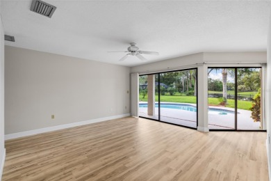 Impressive Carrollwood Village home in a beautiful a on Emerald Greens Golf Resort and Country Club in Florida - for sale on GolfHomes.com, golf home, golf lot