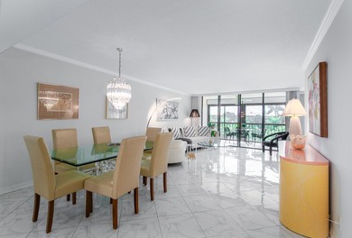 Beautifully renovated corner residence combining the comfort of on The Country Club At Boca Raton in Florida - for sale on GolfHomes.com, golf home, golf lot