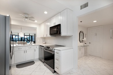 Beautifully renovated corner residence combining the comfort of on The Country Club At Boca Raton in Florida - for sale on GolfHomes.com, golf home, golf lot