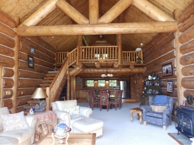 This stunning log home located on the 6th tee of Garland's on Garland Resort and Golf Club  in Michigan - for sale on GolfHomes.com, golf home, golf lot