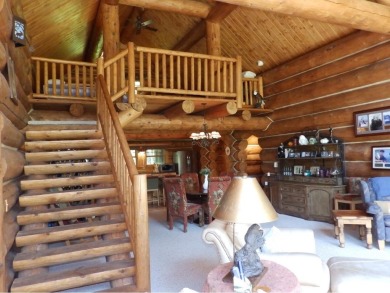 This stunning log home located on the 6th tee of Garland's on Garland Resort and Golf Club  in Michigan - for sale on GolfHomes.com, golf home, golf lot