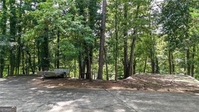 Experience ultimate privacy and breathtaking views from this on The Highlands Course at Lake Arrowhead in Georgia - for sale on GolfHomes.com, golf home, golf lot