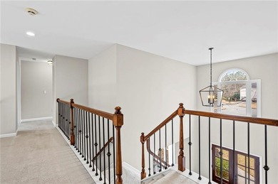 Welcome home to this 6-bedroom, 4-bath home tucked away on a on The Golf Club of Georgia in Georgia - for sale on GolfHomes.com, golf home, golf lot