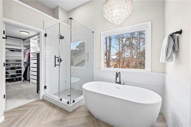 Welcome home to this 6-bedroom, 4-bath home tucked away on a on The Golf Club of Georgia in Georgia - for sale on GolfHomes.com, golf home, golf lot