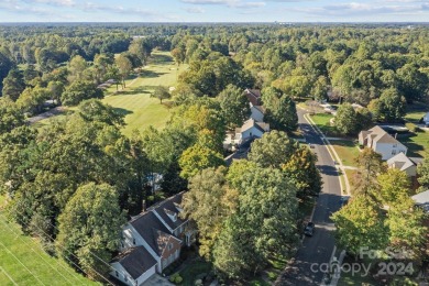 This stunning Muirfield home boasts mature trees and space for on Mooresville Golf Course in North Carolina - for sale on GolfHomes.com, golf home, golf lot