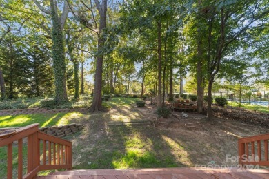 This stunning Muirfield home boasts mature trees and space for on Mooresville Golf Course in North Carolina - for sale on GolfHomes.com, golf home, golf lot