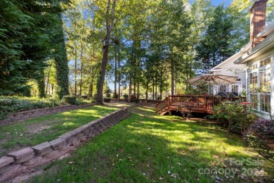 This stunning Muirfield home boasts mature trees and space for on Mooresville Golf Course in North Carolina - for sale on GolfHomes.com, golf home, golf lot