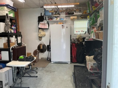 This home truly has it all! Attached RV port built to on Lily Lake Golf and RV Resort in Florida - for sale on GolfHomes.com, golf home, golf lot