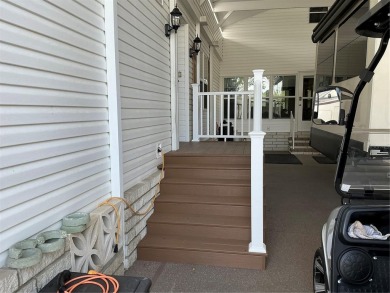 This home truly has it all! Attached RV port built to on Lily Lake Golf and RV Resort in Florida - for sale on GolfHomes.com, golf home, golf lot