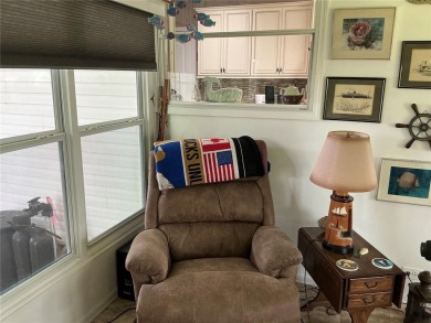 This home truly has it all! Attached RV port built to on Lily Lake Golf and RV Resort in Florida - for sale on GolfHomes.com, golf home, golf lot