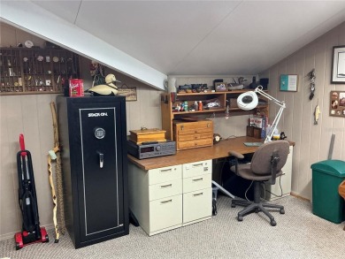 This home truly has it all! Attached RV port built to on Lily Lake Golf and RV Resort in Florida - for sale on GolfHomes.com, golf home, golf lot