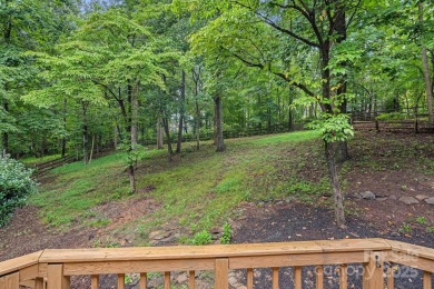 Nestled in the sought-after Highland Creek golf course community on Highland Creek Golf Club in North Carolina - for sale on GolfHomes.com, golf home, golf lot