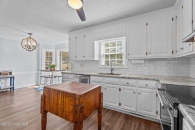 Welcome home to 4804 Burning Tree Lane North, a stately home set on Wilson Country Club in North Carolina - for sale on GolfHomes.com, golf home, golf lot